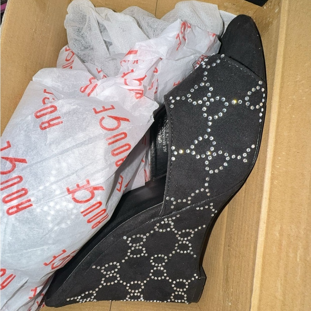 Black Heels with diamond specs.